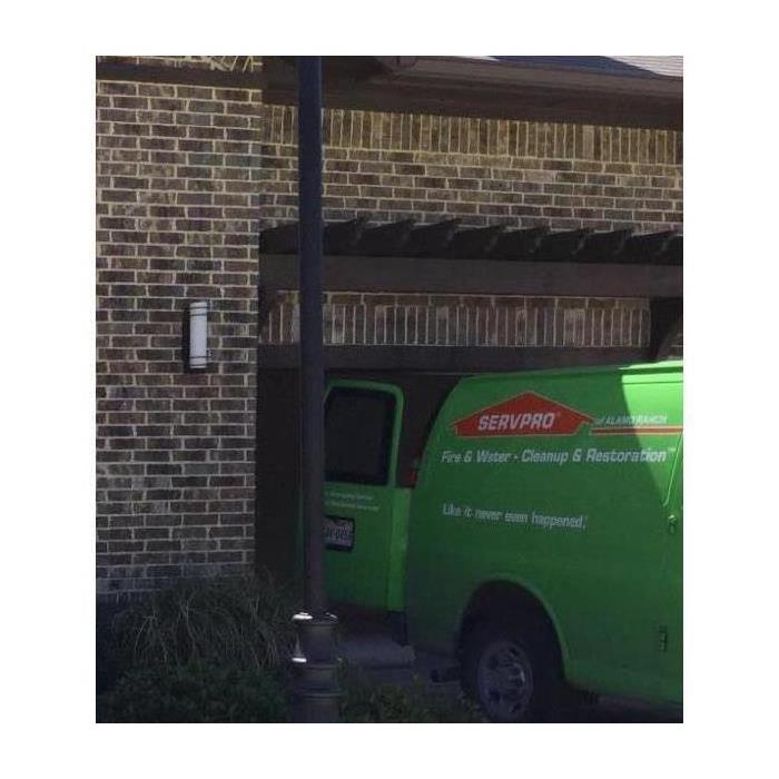 Green van parked in a property