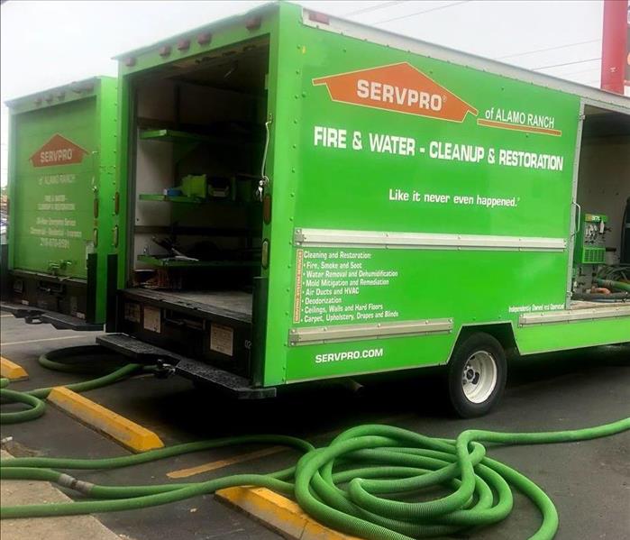 servpro truck with hoses coming from truck mounted extractor