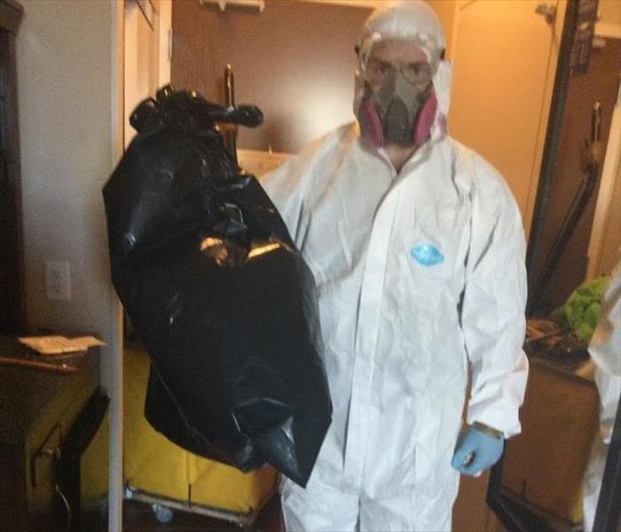 Servpro Employee wearing biohazard PPE